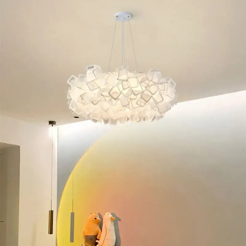 A modern white cloud-shaped DecorBites LED petal ceiling chandelier with soft diffused glow and layered fabric petals