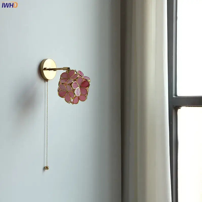 Delicate pink floral decorbites led petal wall sconce with gold metal accents and pull chain switch for stair mirror lighting
