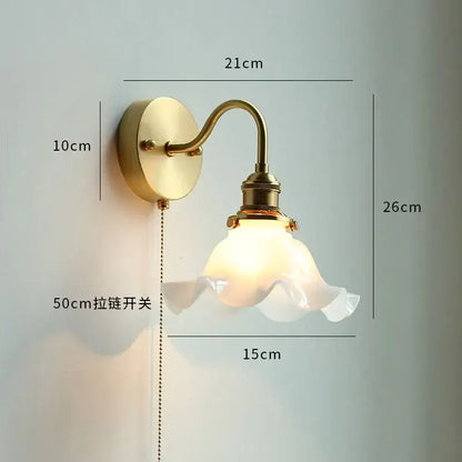Vintage-style brass wall sconce with frosted glass lampshade and ruffled edges from DecorBites led petal wall series