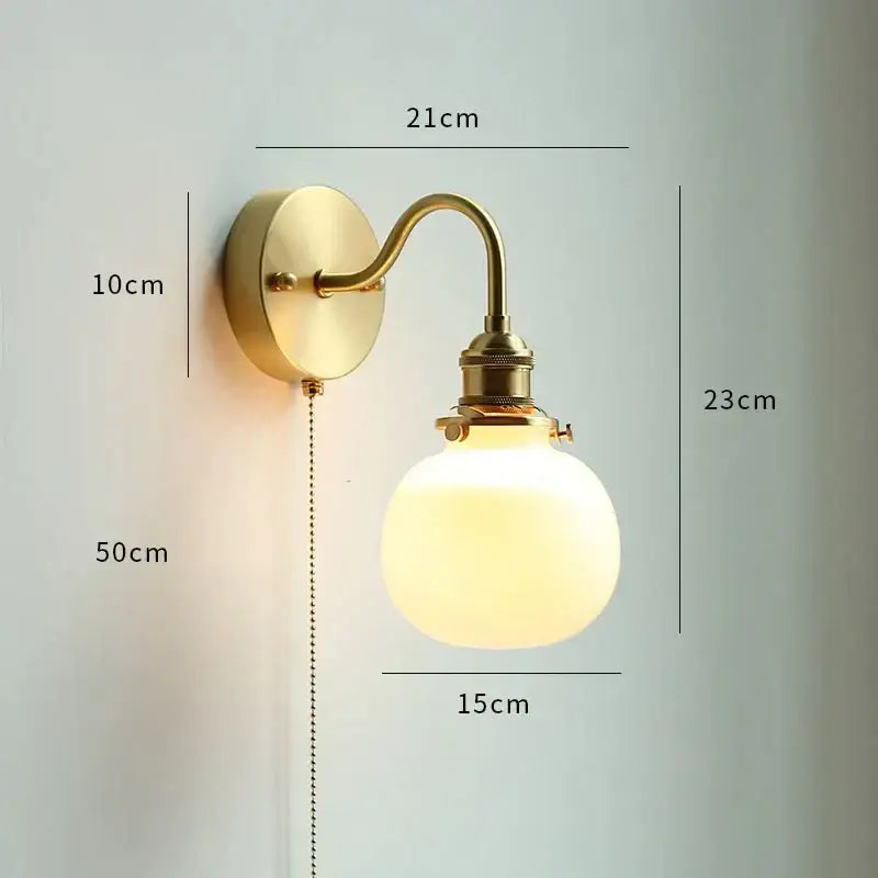 Brass-finished DecorBites led petal wall sconce with frosted glass globe and elegant curved arm for modern Nordic decor