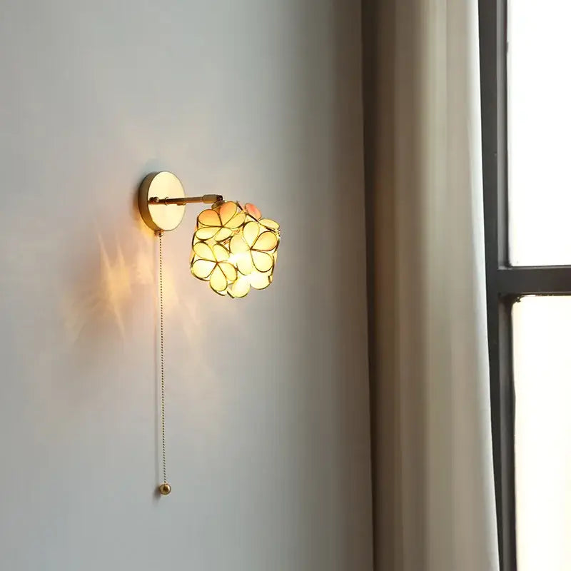 Gold-toned decorbites led petal wall sconce with flower-shaped glass shade and pull chain for modern nordic decor