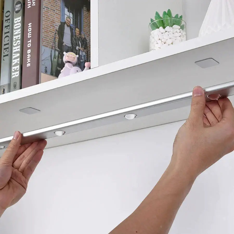 Silver metallic DecorBites LED PIR motion sensor cabinet light with three circular bulbs and two square mounting tabs