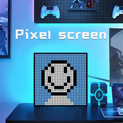 Decorbites led pixel black and white led pixel display showing a smiling face with bluetooth app control for gaming room decor