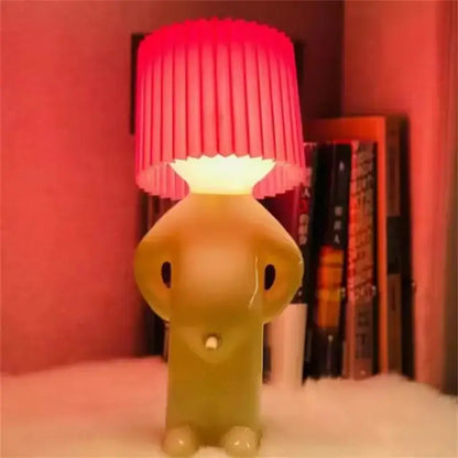 A whimsical translucent yellow elephant-shaped decorbites led pleats table lamp with a vibrant red shade for kids gift