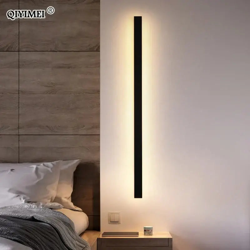 Black rectangular DecorBites LED porch wall sconce with modern design emitting warm ambient light for living room and bedroom