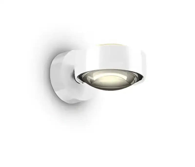White modern decorbites led projection wall lamp with sleek circular design and polished chrome accents for living room