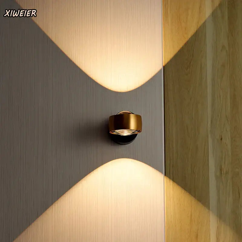 Gold-finished decorbites led projection wall sconce with modern nordic design casting warm x-shaped light pattern