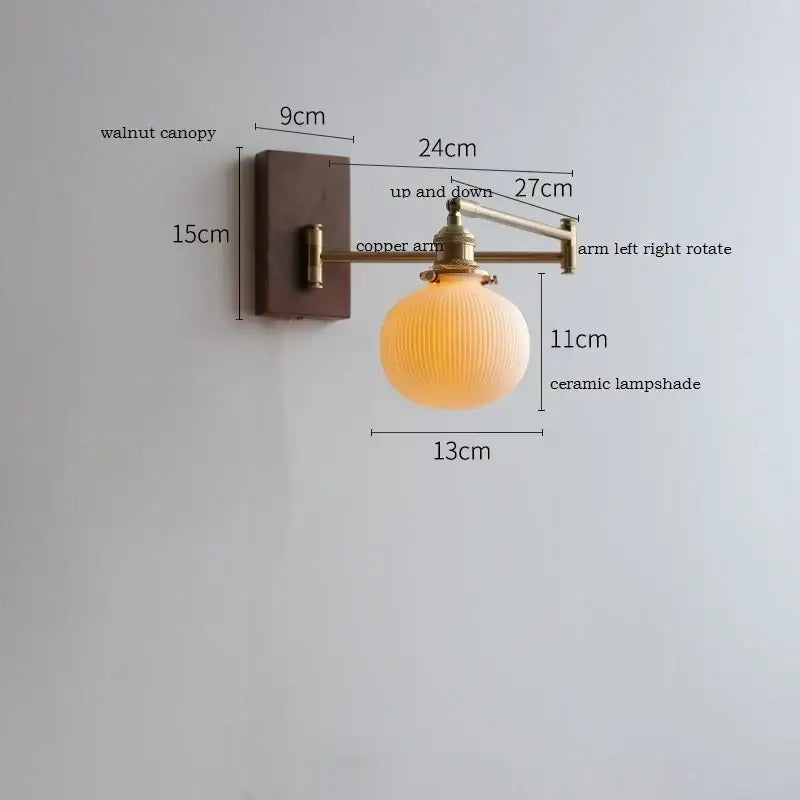 A warm-toned ceramic decorbites led pull wall lamp with vertical ridges on a copper arm and walnut canopy for bedroom use