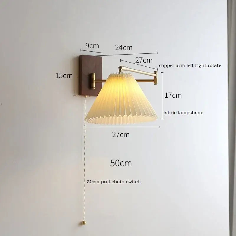 DecorBites led pull chain wall lamp with warm-toned pleated fabric shade copper arm and dark wood mounting plate