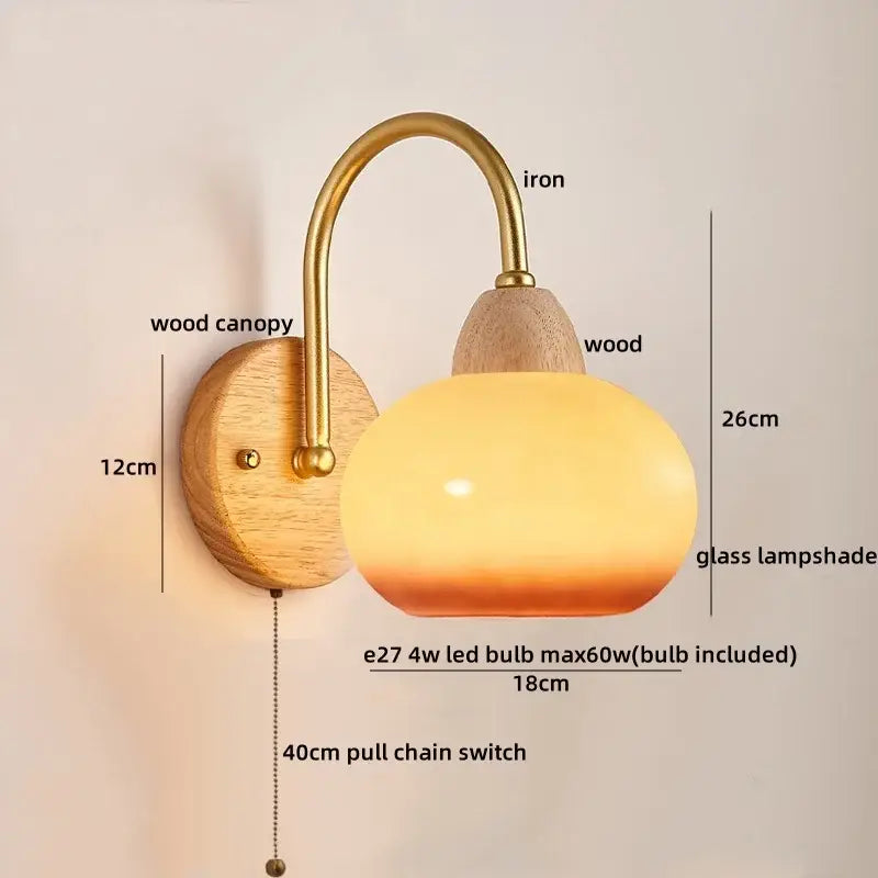 A warm-toned glass lampshade with brass iron arm and wooden canopy in decorbites led pull chain wall lights for bedroom decor