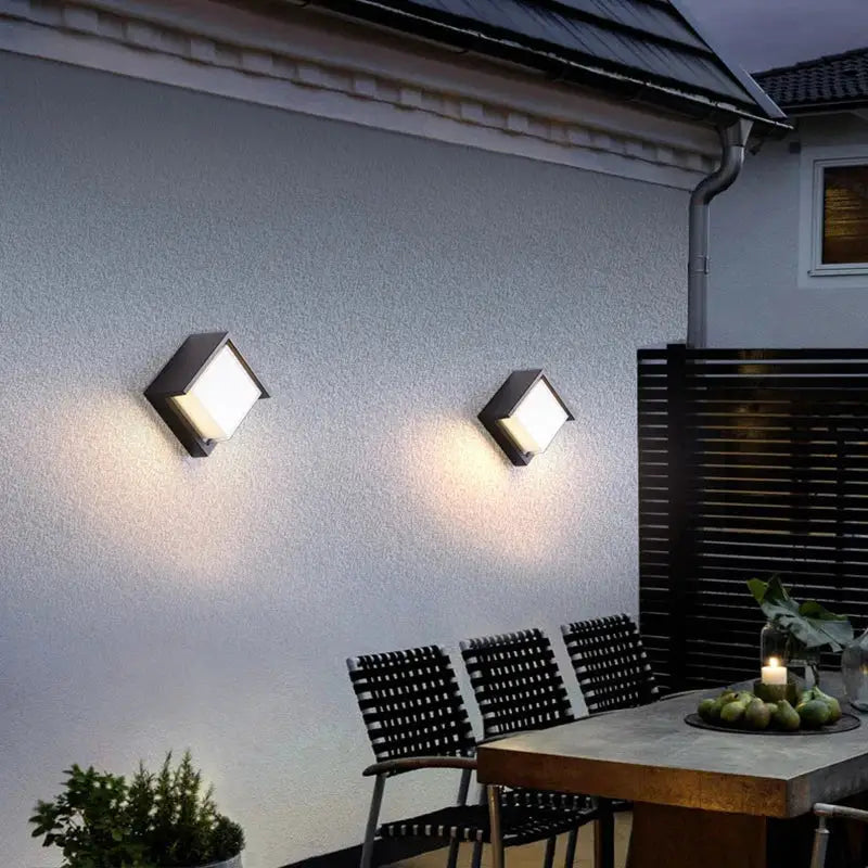 Two modern black decorbites led radar induction wall lamps with bright white LED panels for hotel garden and balcony lighting
