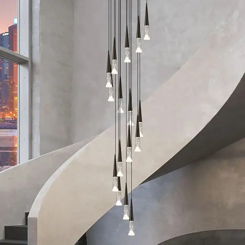 Modern black and clear glass decorbites led rain drop pendant light with sleek minimalist nordic design for staircase or island
