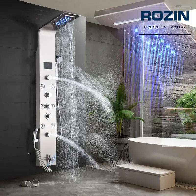 Silver Rozin brand DecorBites LED rain waterfall shower panel with multiple spray settings and blue LED lighting