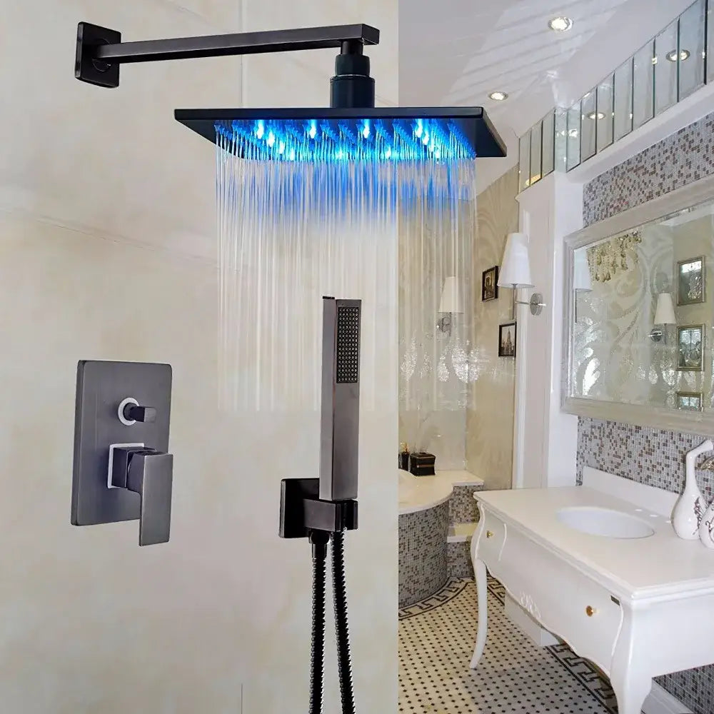 Black square DecorBites LED rainfall shower head with blue LED lighting in a modern shower set for enhanced bathroom decor