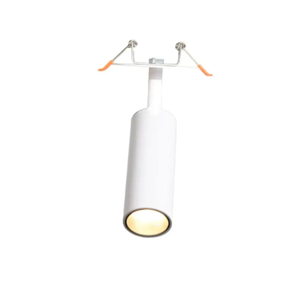 White cylindrical decorbites led recessed ceiling light with warm glow and orange-handled mounting brackets for kitchens