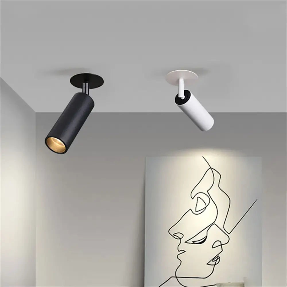 Two modern decorbites led recessed ceiling lights in matte black and white with sleek cylindrical design for kitchen use