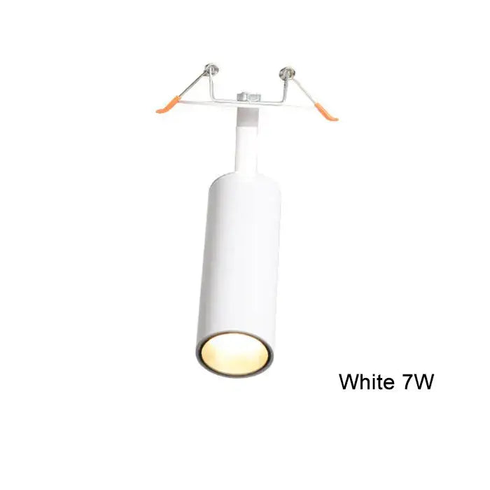 White cylindrical decorbites led recessed ceiling lights with warm glow and adjustable orange-handled clamps for kitchens