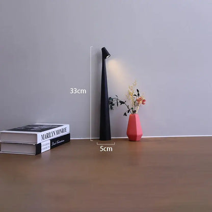 Black slender led rechargeable desk table lamp with pointed top and integrated light standing 33cm tall