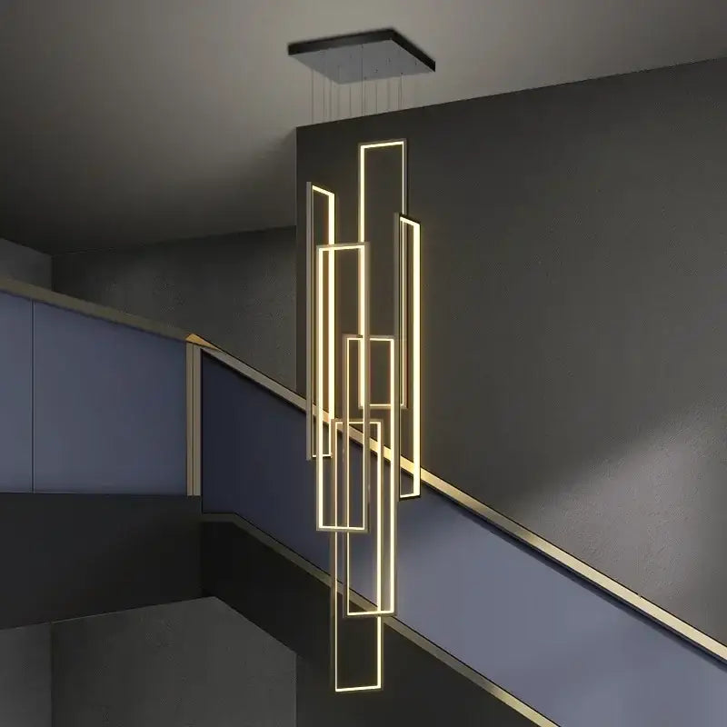 Modern geometric decorbites led rectangle chandelier with glowing gold strips suspended from black ceiling fixture for staircase