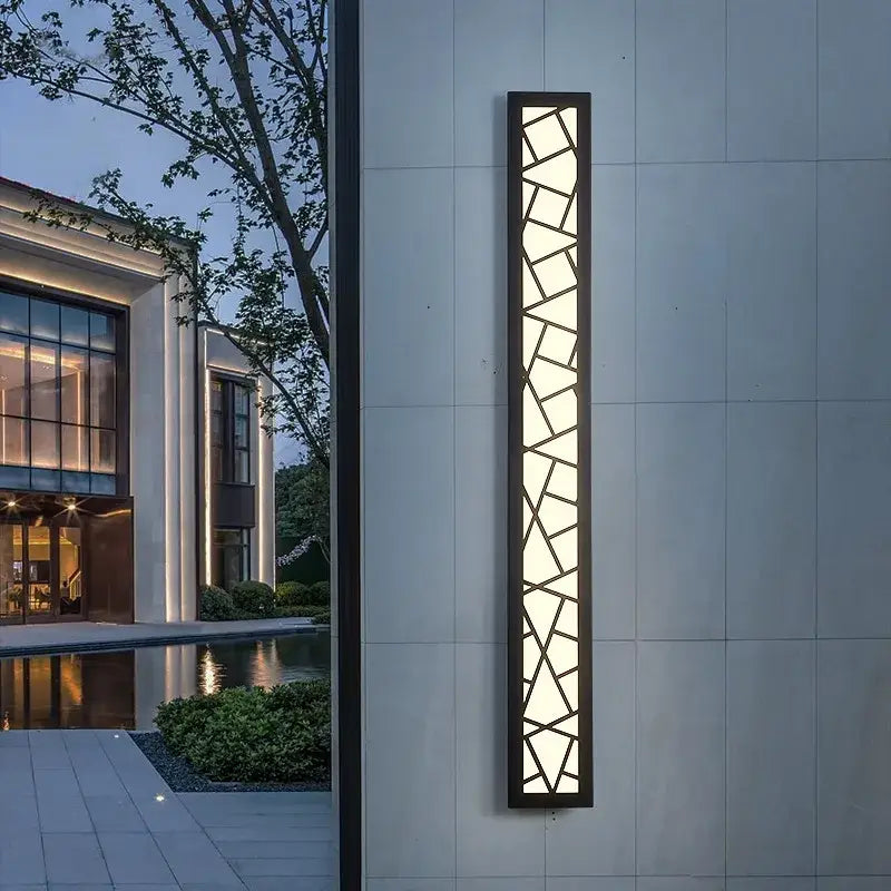 Modern black-framed decorbites led rectangle wall lamp with geometric glass panels emitting warm light for stairs and parlor