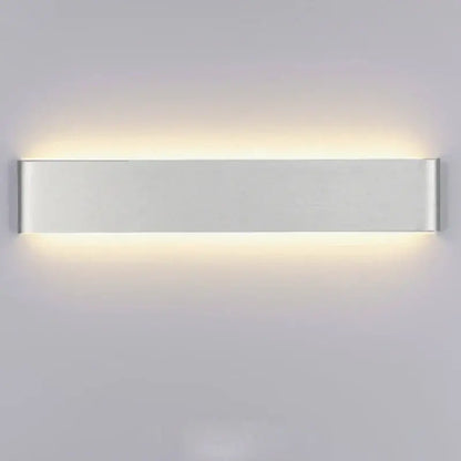 Modern rectangular led wall lamps by decorbites led rectangle with silver metallic finish and warm indoor ambient lighting
