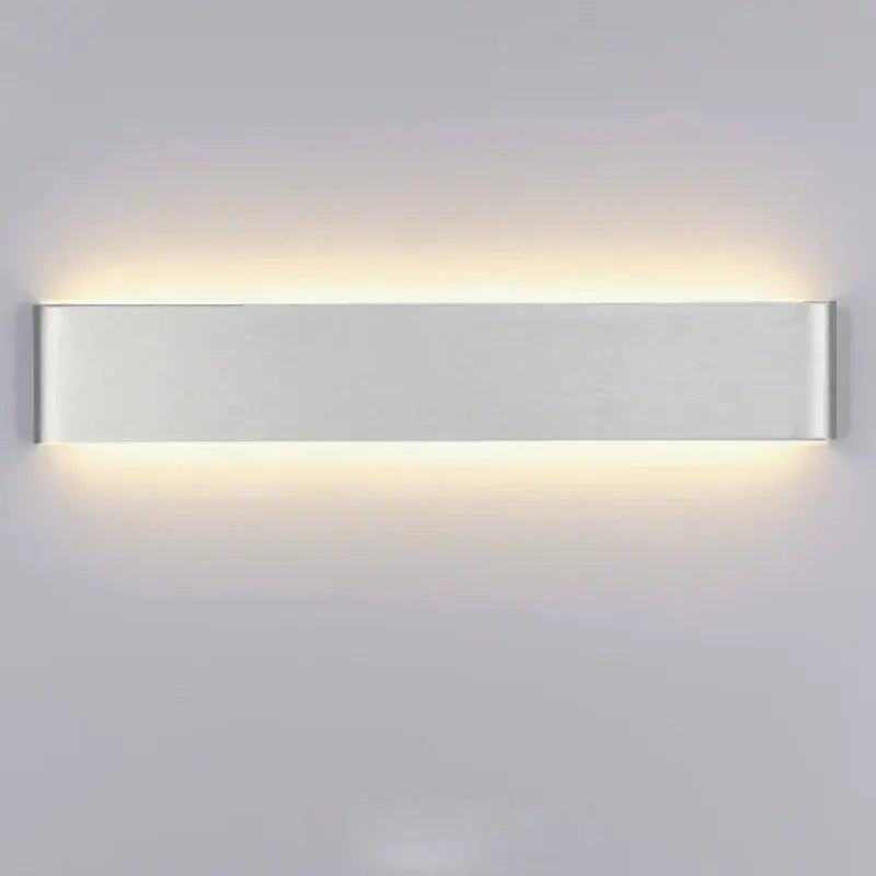 Modern rectangular led wall lamps by decorbites led rectangle with silver metallic finish and warm indoor ambient lighting