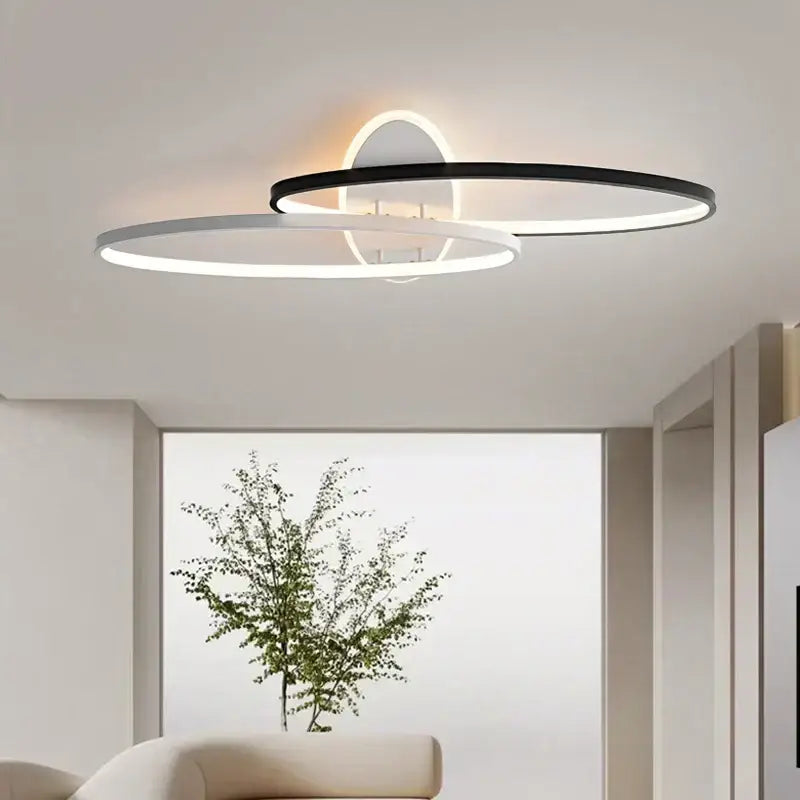 Modern minimalist decorbites led rectangular chandelier with two interlocking black and white circular LED rings for living room