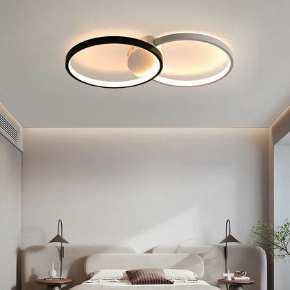 DecorBites led rectangular chandelier with modern dual-ring black and white design emitting warm ambient light
