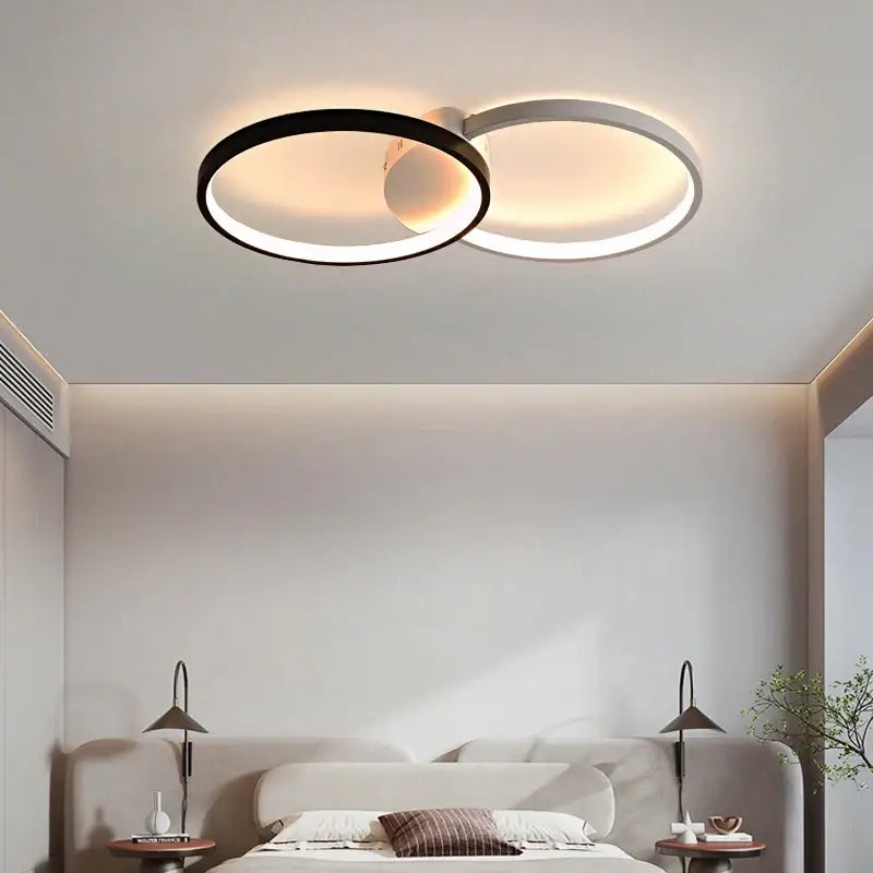 DecorBites led rectangular chandelier with modern dual-ring black and white design emitting warm ambient light