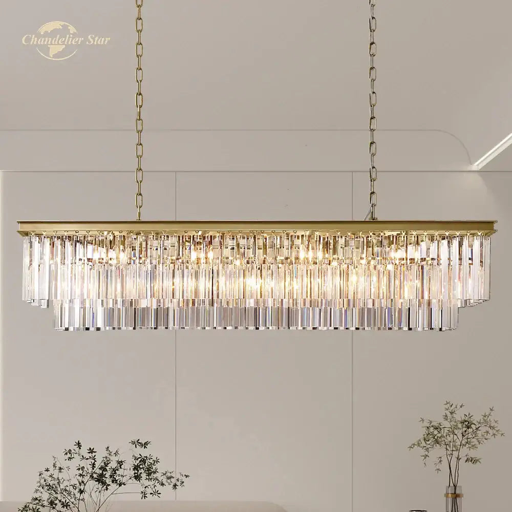 Gold-toned decorbites led rectangular crystal chandelier with cascading clear prisms for dining and kitchen island