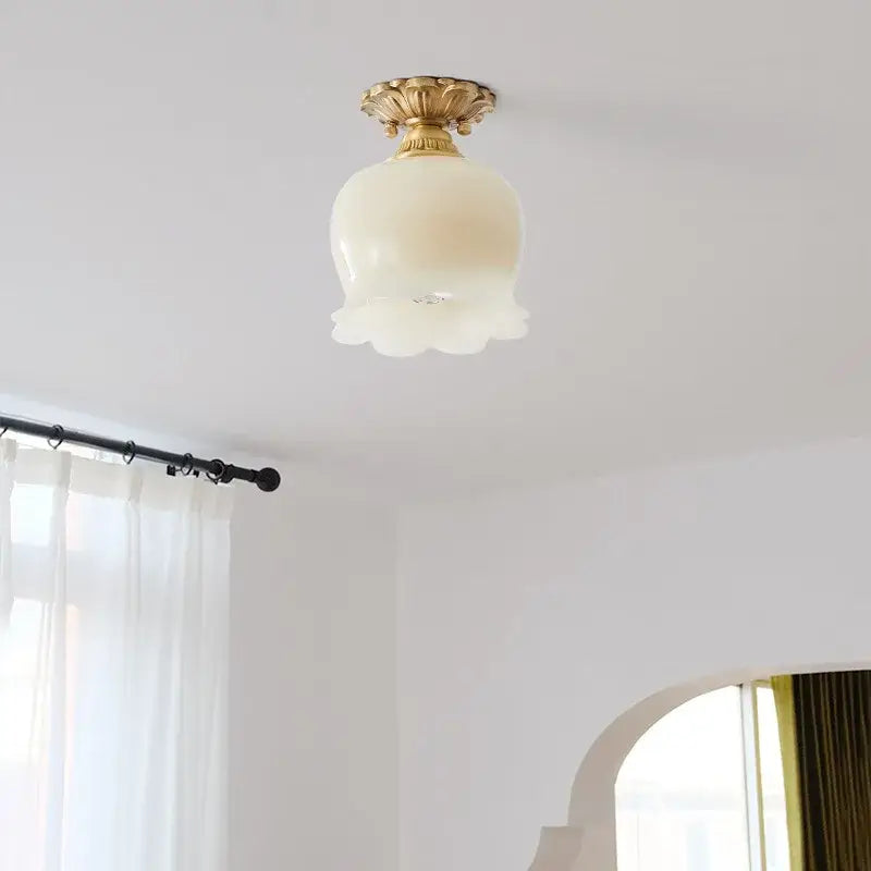 DecorBites led resin ceiling light fixture with golden ornate base and off-white flower-shaped glass shade for porch