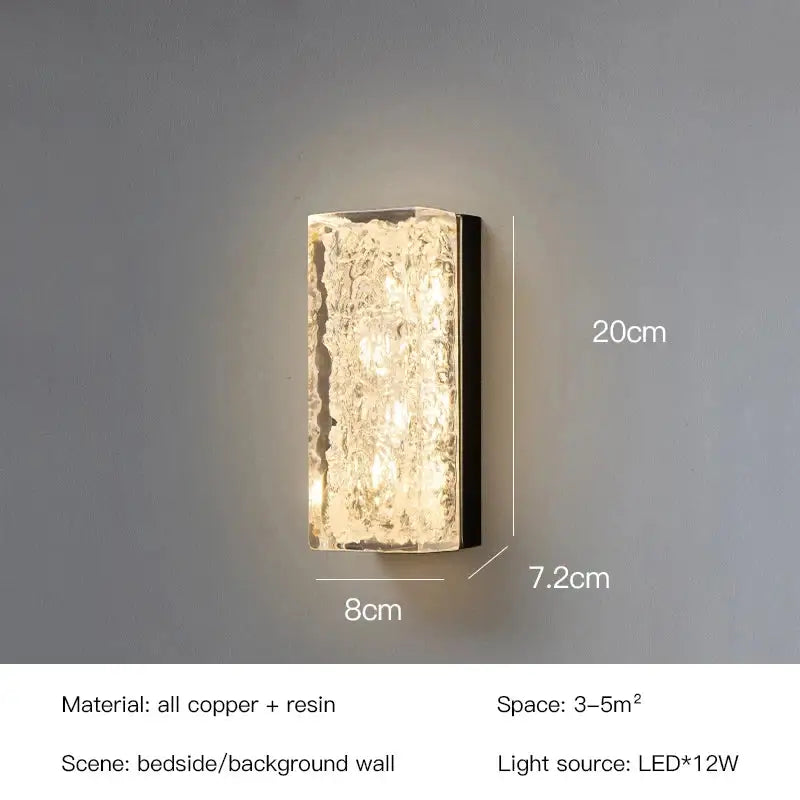 A modern decorbites led resin wall lamp with textured translucent resin front and copper frame for bedroom and living room