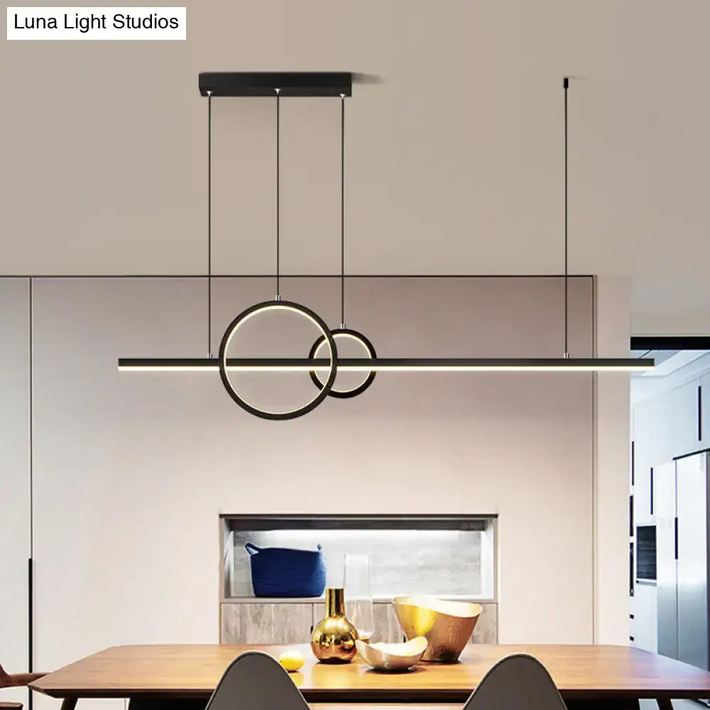 Modern black led restaurant island pendant with sleek circular rings and warm white lighting suspended by thin cables