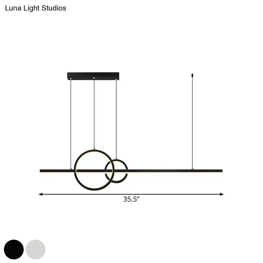 Modern black led restaurant island pendant with sleek circular rings and matte finish providing warm white lighting