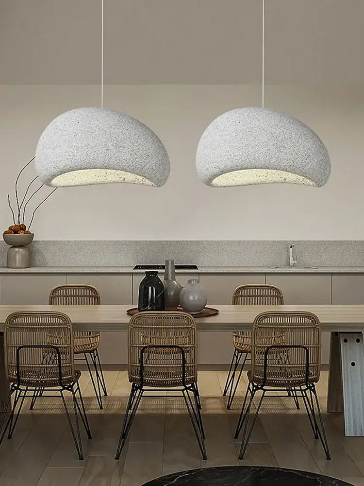 Two off-white textured dome-shaped pendant lights from decorbites led restaurant pendant chandelier above dining table
