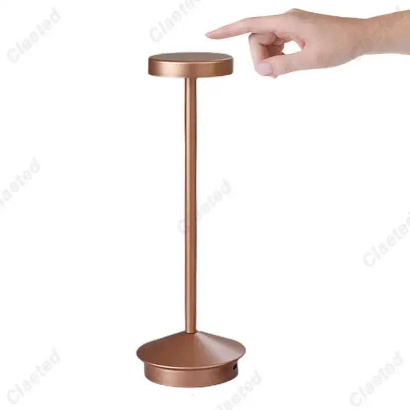 Copper-finished minimalist table lamp with sleek cylindrical stem and circular top decorbites led retro touch night light
