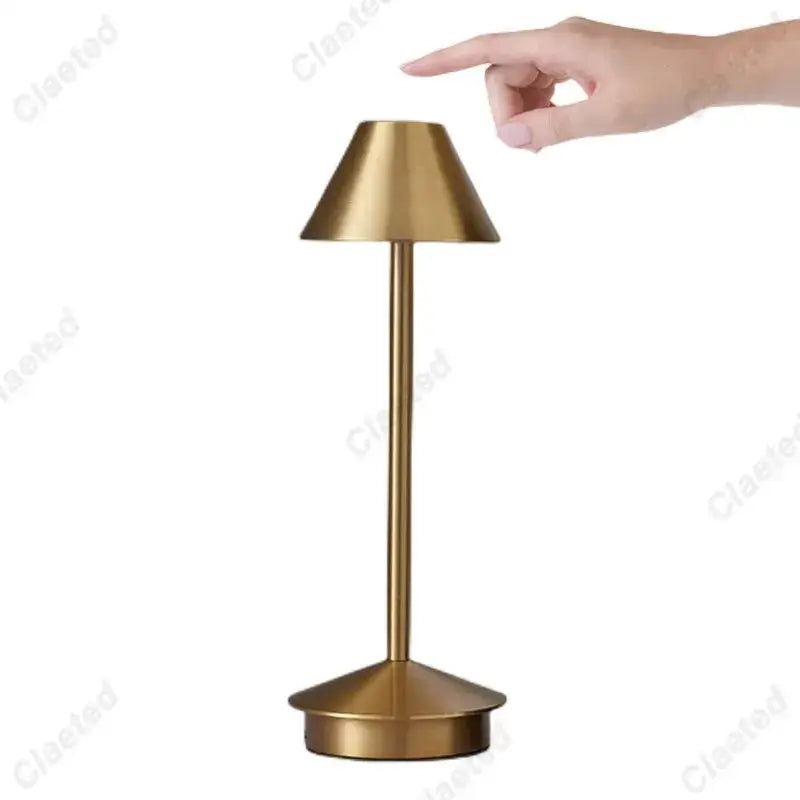 A sleek minimalist decorbites led retro table lamp with brushed gold finish and conical shade featuring led retro touch sensor