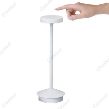 White minimalist table lamp with cylindrical stem and circular base in decorbites led retro touch sensor design