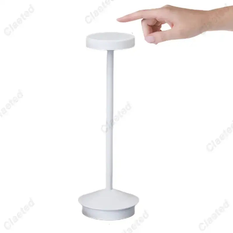 White minimalist table lamp with cylindrical stem and circular base in decorbites led retro touch sensor design