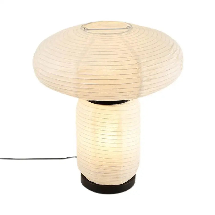 Cream-colored decorbites™ led rice paper table lamp with mushroom-shaped design and black base for modern art decor
