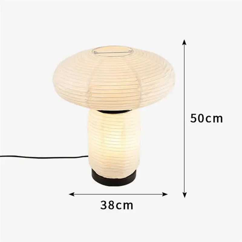 Cream-colored decorbites™ led rice paper table lamp with ribbed mushroom shape and black base minimalist design