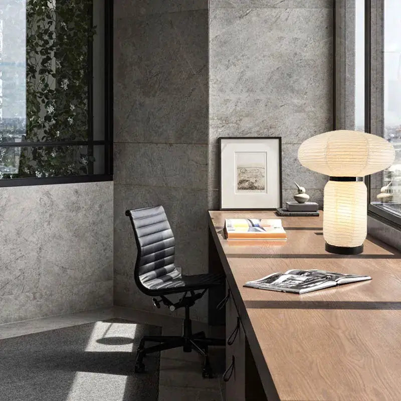 A modern decorbites™ led rice paper table lamp with a softly glowing cylindrical base and ribbed texture