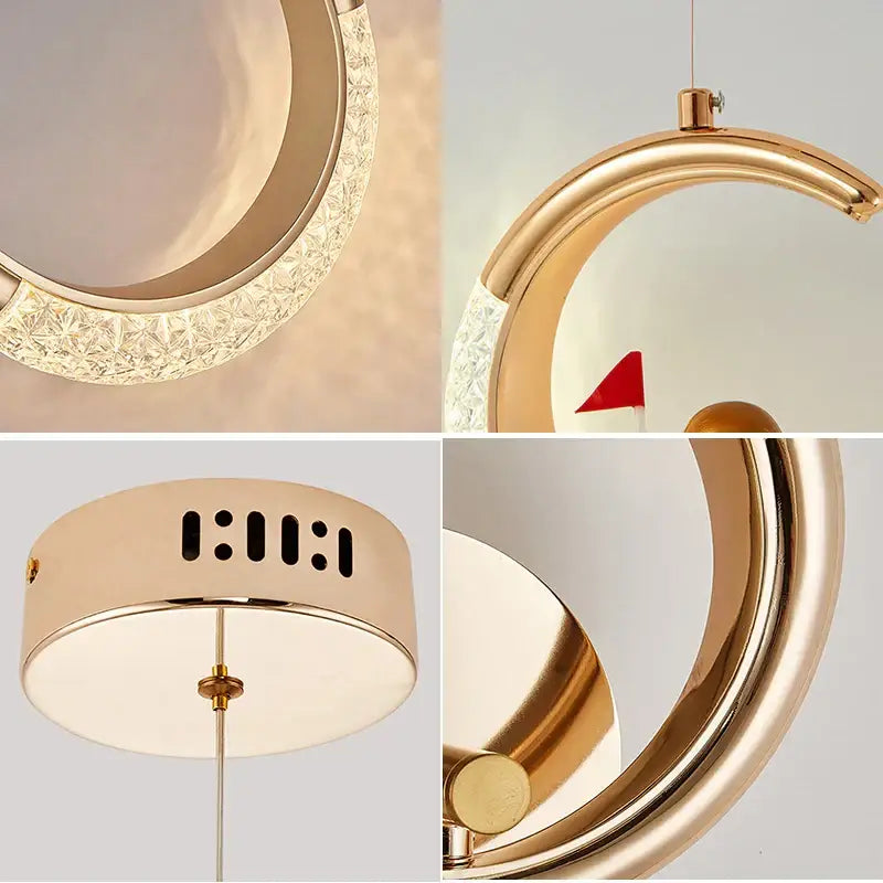 Gold-toned crescent-shaped pendant light with crystal-encrusted edge from decorbites led ring and moon lamps set