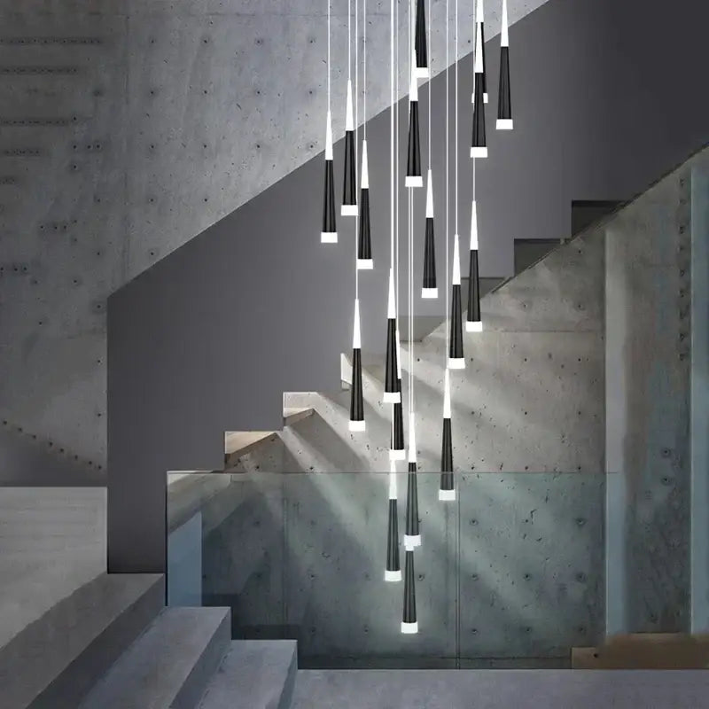 Modern black and white led ring chandelier with conical pendant lights cascading above a staircase for indoor decor