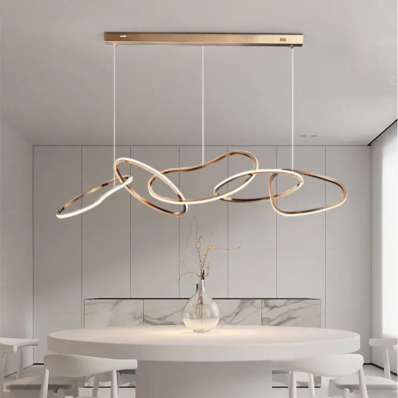Modern gold-toned led ring chandelier with flowing interconnected circular rings for living and dining room decor