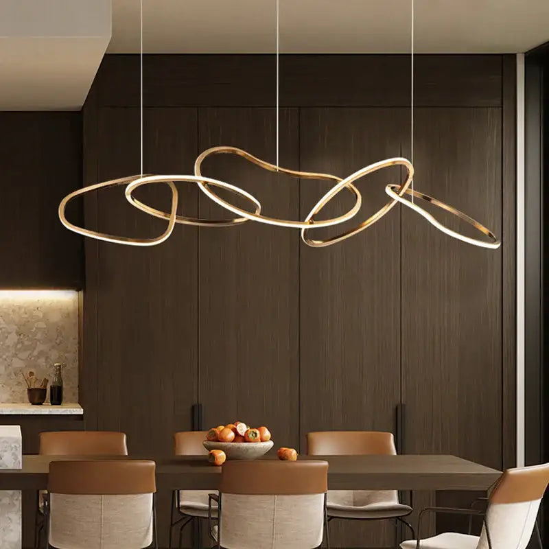 Modern gold-toned led ring chandelier with interlocking circular rings for living and dining room lighting by DecorBites™