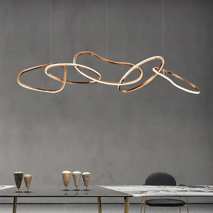 Modern copper-toned DecorBites™ LED ring chandelier with interlocking rings for living and dining room lighting