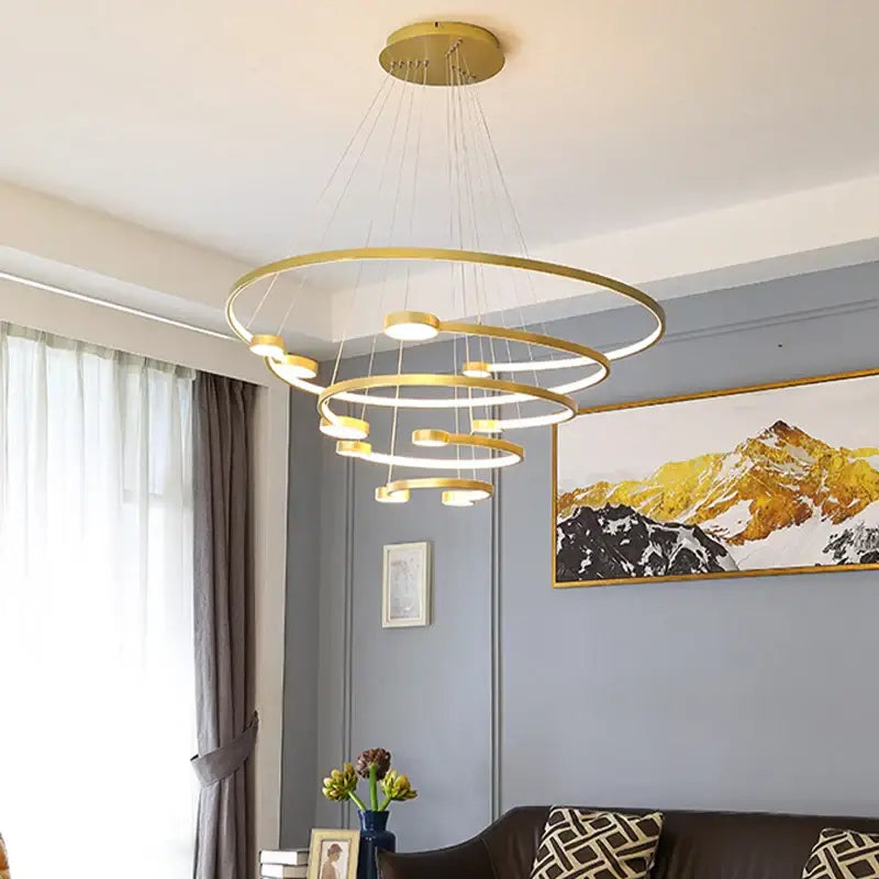 Modern gold-toned led ring chandelier with multiple concentric tiers and integrated led lights for dining and living rooms