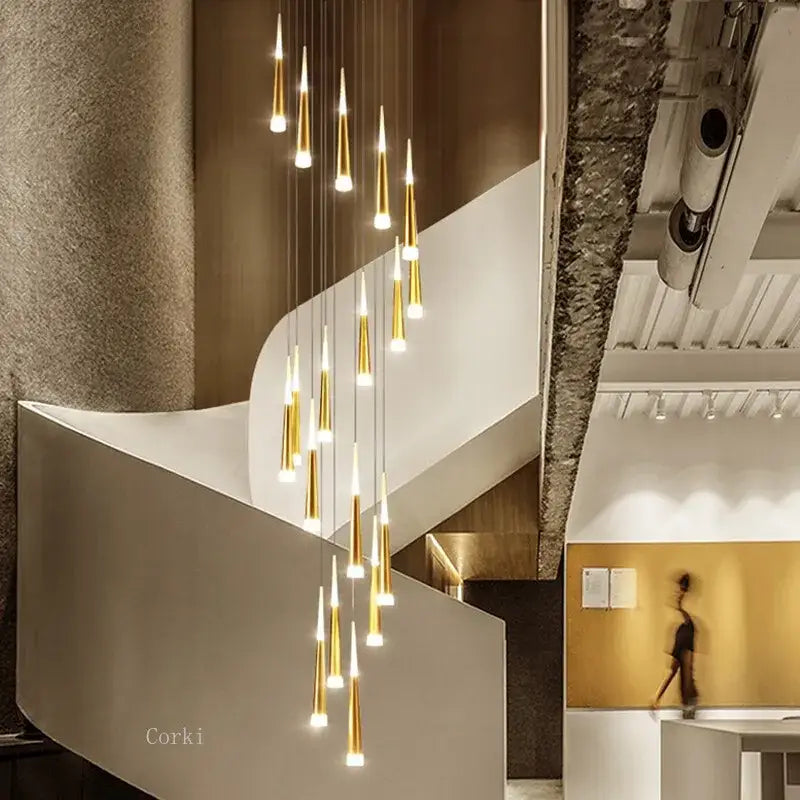 Modern gold-toned led ring chandelier with tapered glass shades cascading, ideal for kitchen or villa decor lighting