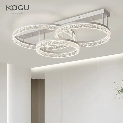 Modern white kagu led ring chandelier with three interlocking crystal rings for elegant home décor lighting